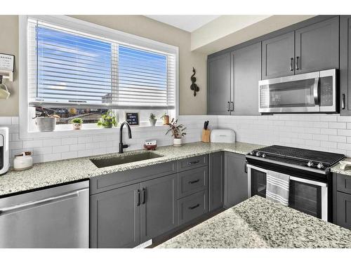 143 Masters Square Se, Calgary, AB - Indoor Photo Showing Kitchen With Upgraded Kitchen