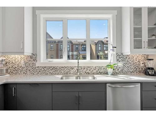 53 Spring Willow Close Sw, Calgary, AB - Indoor Photo Showing Kitchen With Double Sink