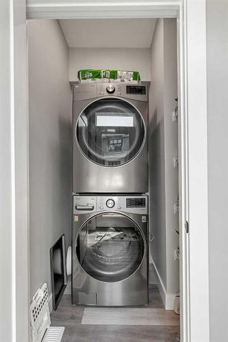 53 Spring Willow Close Sw, Calgary, AB - Indoor Photo Showing Laundry Room