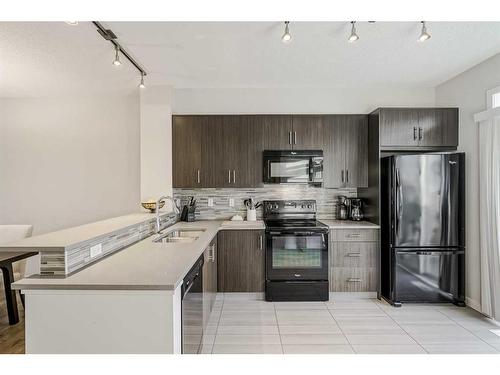 118 Walden Circle Se, Calgary, AB - Indoor Photo Showing Kitchen With Double Sink