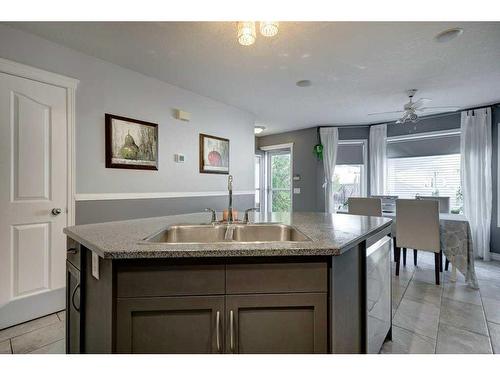 97 Cramond Close Se, Calgary, AB - Indoor Photo Showing Kitchen With Double Sink