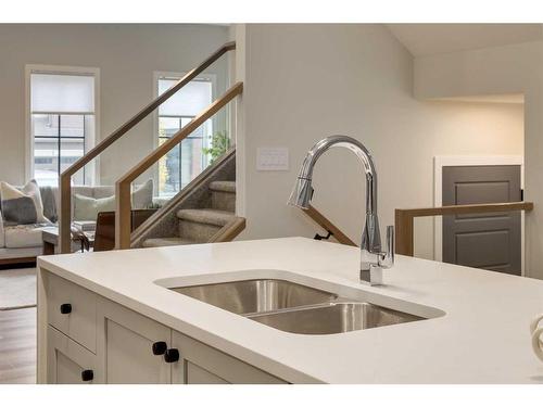 1129 Chinook Gate Bay Sw, Airdrie, AB - Indoor Photo Showing Kitchen With Double Sink