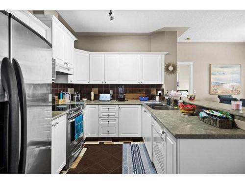 18 Rocky Vista Terrace Nw, Calgary, AB - Indoor Photo Showing Kitchen With Double Sink