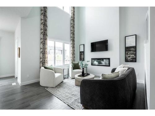 212 Sora Terrace Se, Calgary, AB - Indoor Photo Showing Living Room With Fireplace