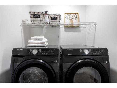 212 Sora Terrace Se, Calgary, AB - Indoor Photo Showing Laundry Room