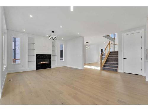 38 South Shore Road, Chestermere, AB - Indoor Photo Showing Living Room With Fireplace