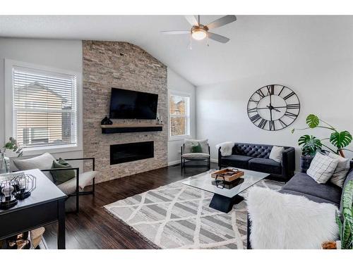 1391 Ravenscroft Way Se, Airdrie, AB - Indoor Photo Showing Living Room With Fireplace