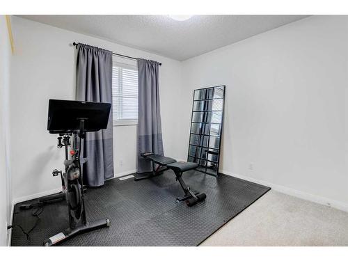 1391 Ravenscroft Way Se, Airdrie, AB - Indoor Photo Showing Gym Room