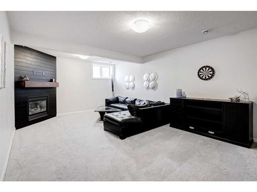 1391 Ravenscroft Way Se, Airdrie, AB - Indoor With Fireplace