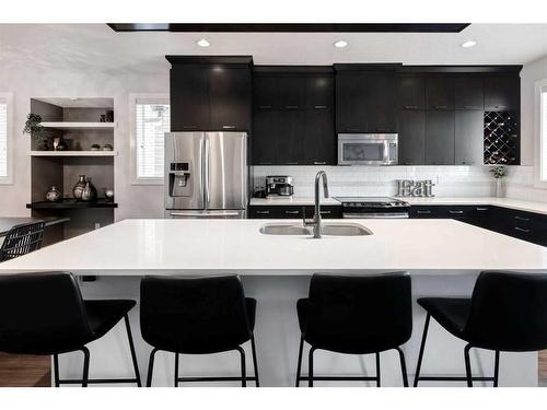 1391 Ravenscroft Way Se, Airdrie, AB - Indoor Photo Showing Kitchen With Double Sink With Upgraded Kitchen