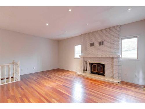 120 6 Avenue Nw, Calgary, AB - Indoor With Fireplace