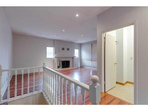 120 6 Avenue Nw, Calgary, AB - Indoor Photo Showing Other Room With Fireplace