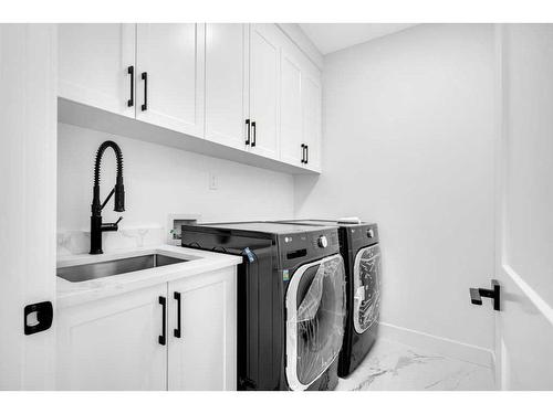 42 South Shore Bay, Chestermere, AB - Indoor Photo Showing Laundry Room