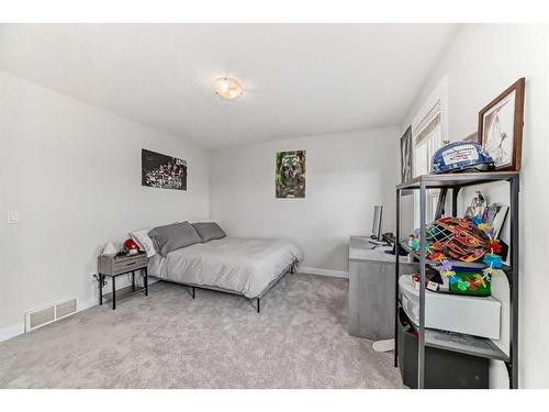 213 Rainbow Falls Drive, Chestermere, AB - Indoor Photo Showing Bedroom