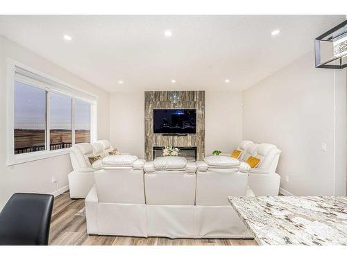 112 Belvedere Drive Se, Calgary, AB - Indoor Photo Showing Living Room With Fireplace