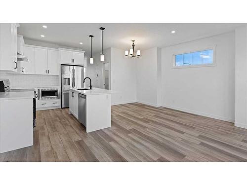 394 Alpine Avenue Sw, Calgary, AB - Indoor Photo Showing Kitchen With Stainless Steel Kitchen