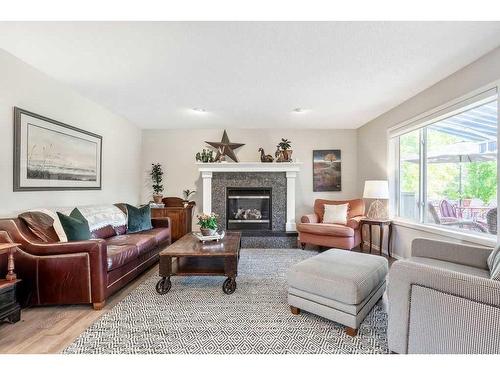 225 Mt Douglas Close Se, Calgary, AB - Indoor Photo Showing Living Room With Fireplace