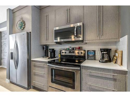 46-111 Rainbow Falls Gate, Chestermere, AB - Indoor Photo Showing Kitchen