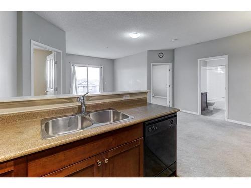 1310-1140 Taradale Drive Ne, Calgary, AB - Indoor Photo Showing Kitchen With Double Sink