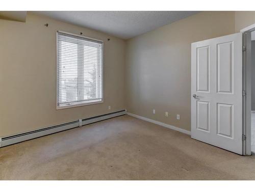 1310-1140 Taradale Drive Ne, Calgary, AB - Indoor Photo Showing Other Room