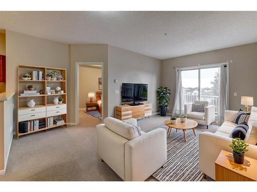 1310-1140 Taradale Drive Ne, Calgary, AB - Indoor Photo Showing Living Room