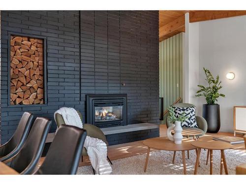 11 Cumberland Drive Nw, Calgary, AB - Indoor Photo Showing Living Room With Fireplace