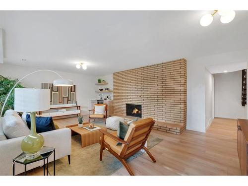 11 Cumberland Drive Nw, Calgary, AB - Indoor Photo Showing Living Room With Fireplace