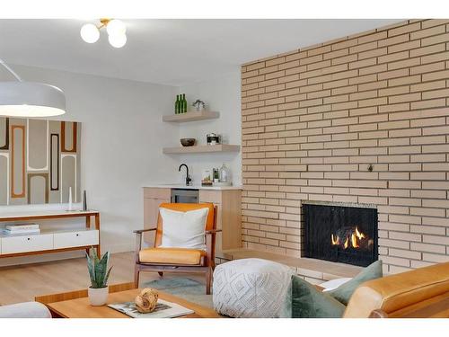 11 Cumberland Drive Nw, Calgary, AB - Indoor Photo Showing Living Room With Fireplace