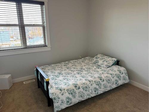 2120 21 Avenue, Didsbury, AB - Indoor Photo Showing Bedroom