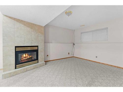 15 Village Green, Carstairs, AB - Indoor With Fireplace