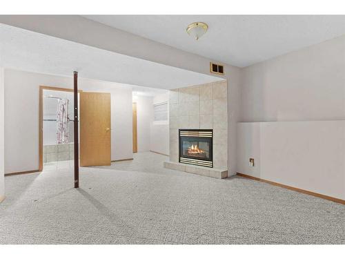 15 Village Green, Carstairs, AB - Indoor With Fireplace