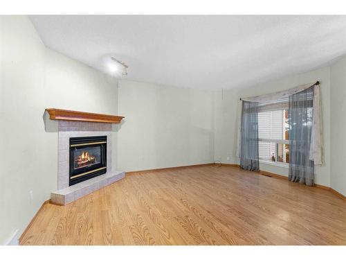 15 Village Green, Carstairs, AB - Indoor Photo Showing Living Room With Fireplace