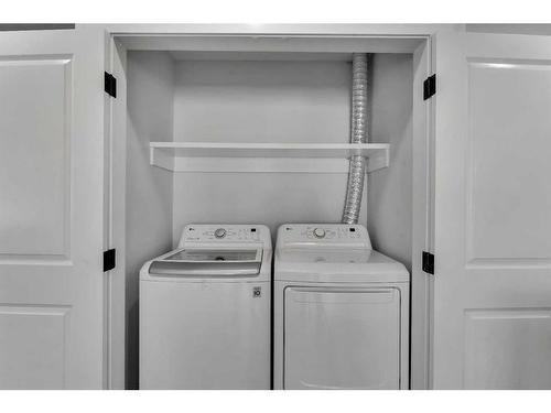 727 Hunterston Road Nw, Calgary, AB - Indoor Photo Showing Laundry Room