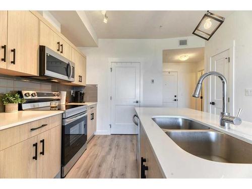 2308-200 Seton Circle Se, Calgary, AB - Indoor Photo Showing Kitchen With Double Sink