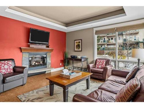 106-173 Kananaskis Way, Canmore, AB - Indoor Photo Showing Living Room With Fireplace