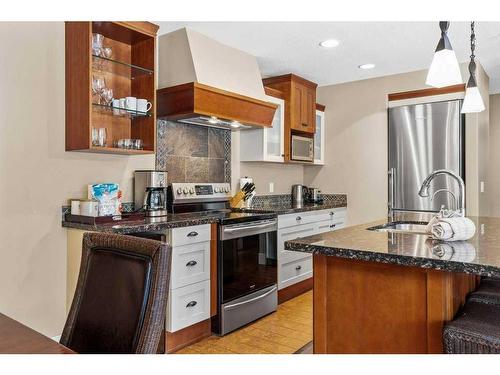 106-173 Kananaskis Way, Canmore, AB - Indoor Photo Showing Kitchen With Double Sink