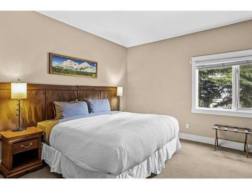 106-173 Kananaskis Way, Canmore, AB - Indoor Photo Showing Bedroom