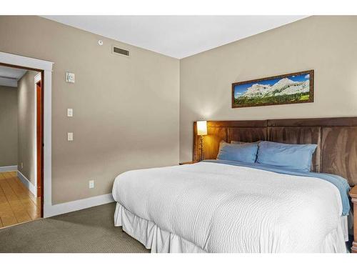 106-173 Kananaskis Way, Canmore, AB - Indoor Photo Showing Bedroom