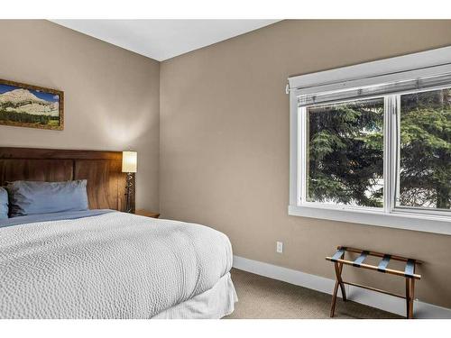 106-173 Kananaskis Way, Canmore, AB - Indoor Photo Showing Bedroom