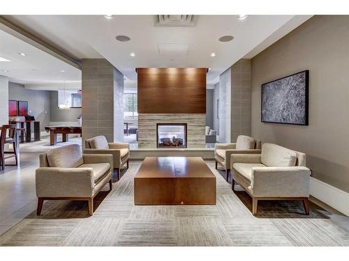 1407-128 2 Street Sw, Calgary, AB - Indoor Photo Showing Living Room With Fireplace