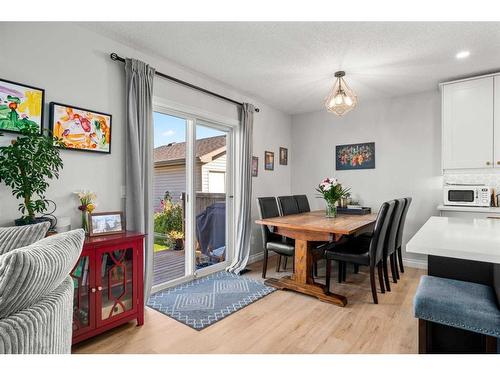 65 Crystal Shores Crescent, Okotoks, AB - Indoor Photo Showing Dining Room