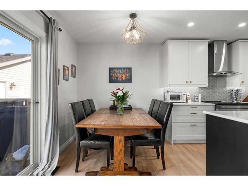 65 Crystal Shores Crescent, Okotoks, AB - Indoor Photo Showing Dining Room