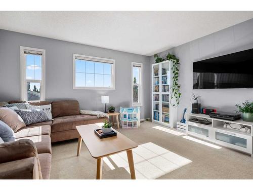 65 Crystal Shores Crescent, Okotoks, AB - Indoor Photo Showing Living Room