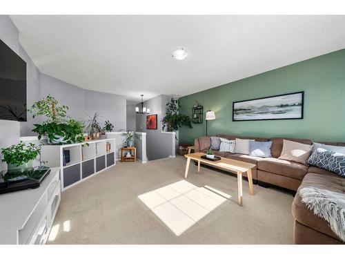 65 Crystal Shores Crescent, Okotoks, AB - Indoor Photo Showing Living Room