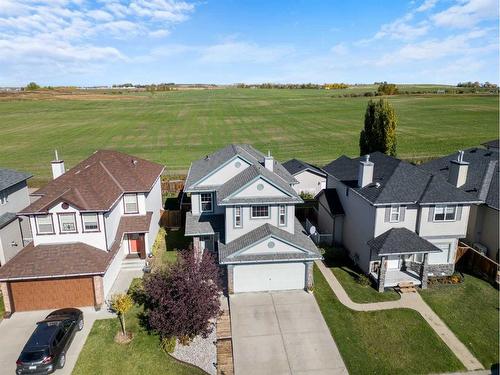 65 Crystal Shores Crescent, Okotoks, AB - Outdoor With Facade