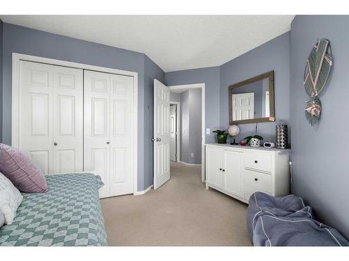 65 Crystal Shores Crescent, Okotoks, AB - Indoor Photo Showing Bedroom