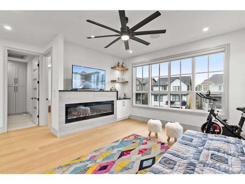 1473 Coopers Landing Sw, Airdrie, AB - Indoor Photo Showing Living Room With Fireplace