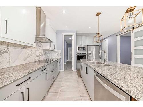 107 Legacy Landing Se, Calgary, AB - Indoor Photo Showing Kitchen With Double Sink With Upgraded Kitchen