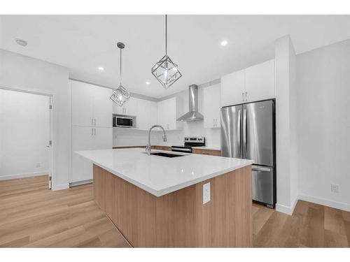 313 Baneberry Way Sw, Airdrie, AB - Indoor Photo Showing Kitchen With Upgraded Kitchen