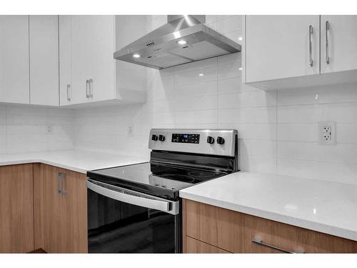 313 Baneberry Way Sw, Airdrie, AB - Indoor Photo Showing Kitchen